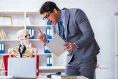 The angry boss yelling at his skeleton employee Stock Photo The angry boss yelling at his skeleton employee Stock Photo
