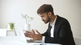 Angry emotional businessman troubled with sudden broken hanging computer failure stock video footage Angry emotional businessman troubled with sudden broken hanging computer failure stock video footage