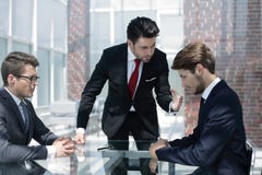 Annoyed businessman scolds his employees Stock Image Annoyed businessman scolds his employees Stock Image