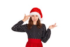 Annoyed and displeased woman in dress shrugging and holding fingers on temple. emotional girl in santa claus christmas hat isolate royalty free stock images Annoyed and displeased woman in dress shrugging and holding fingers on temple. emotional girl in santa claus christmas hat isolate royalty free stock images