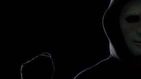 Anonymous man cracking server system, worldwide cyber terrorism problem stock footage Anonymous man cracking server system, worldwide cyber terrorism problem stock footage