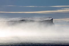 Antarctic table iceberg in morning mists