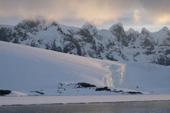 Antarctica calm pink midnight sunset over jagged mountains stock photography Antarctica calm pink midnight sunset over jagged mountains stock photography