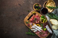 Antipasto - sliced meat, ham, salami, olives and wine top view. stock image Antipasto - sliced meat, ham, salami, olives and wine top view. stock image