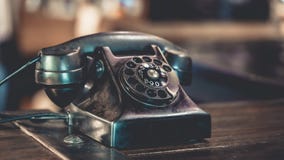 Antique Black Telephone On Wooden Table royalty free stock image Antique Black Telephone On Wooden Table royalty free stock image
