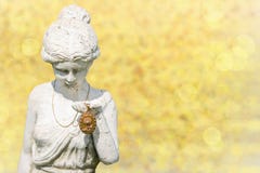 An antique gold medallion will presented from stone statue woman stock image An antique gold medallion will presented from stone statue woman stock image
