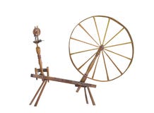Antique large wheel spinning wheel isolated. stock image Antique large wheel spinning wheel isolated. stock image