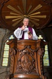 Antique pulpit and priest stock photo Antique pulpit and priest stock photo