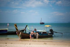 Ao Phra Nang Cave Beach, Railay beach, Krabi, Thailand - February 12, 2019: Water taxi on Thailand. Boat meets and receives stock photos Ao Phra Nang Cave Beach, Railay beach, Krabi, Thailand - February 12, 2019: Water taxi on Thailand. Boat meets and receives stock photos