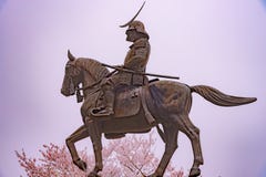A statue of Masamune Date on horseback entering Sendai Castle in full bloom cherry blossom, Aobayama Park, Sendai, Miyagi, Japan stock images A statue of Masamune Date on horseback entering Sendai Castle in full bloom cherry blossom, Aobayama Park, Sendai, Miyagi, Japan stock images