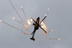 Apache attack helicopter and flares royalty free stock photography Apache attack helicopter and flares royalty free stock photography