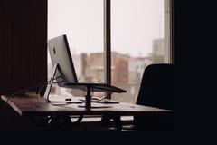 Apple iMac on Desk by Window Stock Photography Apple iMac on Desk by Window Stock Photography