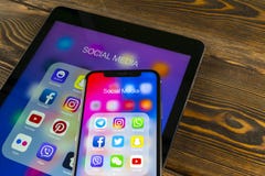 Apple iPad and iPhone X with icons of social media facebook, instagram, twitter, snapchat application on screen. Social media icon