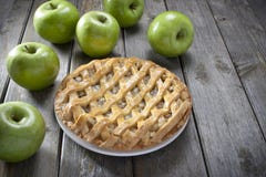 Apple Pie Dessert Food. An apple pie with green apples on a rustic wood background. Can be used with similar image no.27312817 and 27312667 Apple Pie Dessert Food. An apple pie with green apples on a rustic wood background. Can be used with similar image no.27312817 and 27312667