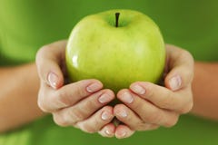 Apple in woman hands
