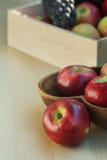 Apples and grapes in a wooden box, close up stock images Apples and grapes in a wooden box, close up stock images