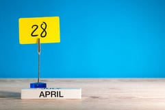 April 28th. Day 28 of april month, calendar on little yellow tag. Spring time. Empty space for text, mockup or template Royalty Free Stock Images April 28th. Day 28 of april month, calendar on little yellow tag. Spring time. Empty space for text, mockup or template Royalty Free Stock Images