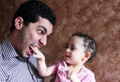 Arab egyptian baby girl playing with her father