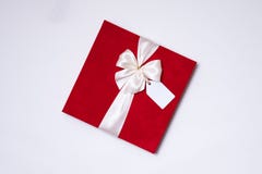 Arc romantique de ruban de cadeau de jour de valentines, étiquette de cadeau, fond blanc actuel et sans couture, l'espace des tex photos stock Arc romantique de ruban de cadeau de jour de valentines, étiquette de cadeau, fond blanc actuel et sans couture, l'espace des tex photos stock