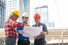Architect engineer team planning blue print in construction city site. Workers security control. royalty free stock photography Architect engineer team planning blue print in construction city site. Workers security control. royalty free stock photography