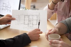 Architect, realtor or designer consulting couple with apartment stock photo Architect, realtor or designer consulting couple with apartment stock photo