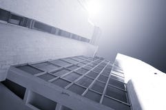 Architecture Futuristic Background - Perspective Bottom View Of High Building Of Concrete And Glass. Stock Images Architecture Futuristic Background - Perspective Bottom View Of High Building Of Concrete And Glass. Stock Images