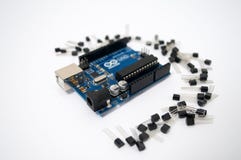 Arduino and around transistors lined up stock photos Arduino and around transistors lined up stock photos