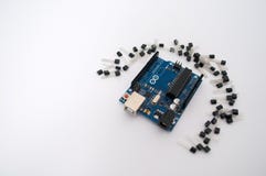 Arduino and around transistors lined up royalty free stock photo Arduino and around transistors lined up royalty free stock photo