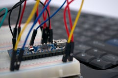 Arduino, transistors, protoboard with LED lined up royalty free stock photography Arduino, transistors, protoboard with LED lined up royalty free stock photography