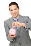 Argent gai d'économie d'homme d'affaires à un porcin-côté image libre de droits Argent gai d'économie d'homme d'affaires à un porcin-côté image libre de droits