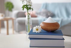 Aroma oil diffuser on stack of books royalty free stock photo Aroma oil diffuser on stack of books royalty free stock photo