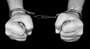 Arrest, Hands With Handcuffs. Stock Photo