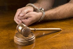 Arrested man and gavel royalty free stock photo Arrested man and gavel royalty free stock photo