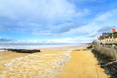 Arromanches les Bains, Normandy, France. seafront beach and remains of the artificial harbor stock image Arromanches les Bains, Normandy, France. seafront beach and remains of the artificial harbor stock image