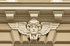 Art deco style decoration of head with wings royalty free stock photo Art deco style decoration of head with wings royalty free stock photo