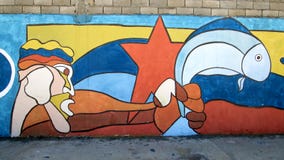 Arte urbano Pescados de ofrecimiento Imagen de archivo libre de regalías Arte urbano Pescados de ofrecimiento Imagen de archivo libre de regalías