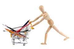 Articulated wooden dummy pushing a supermarket trolley with school supplies royalty free stock photos Articulated wooden dummy pushing a supermarket trolley with school supplies royalty free stock photos