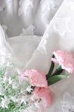 Artificial Flowers On Chiffon Fabric Background Royalty Free Stock Photos
