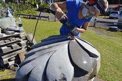 Artist stone sculptor carving sculpting huge New Zealand Silver Fern art piece