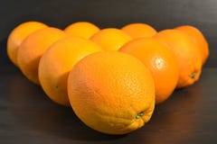 Composition of a group of ripe oranges in a shape of a triangle. royalty free stock photo Composition of a group of ripe oranges in a shape of a triangle. royalty free stock photo