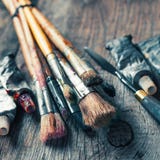 Artistic Paintbrushes, Tubes Of Oil Paint, Palette Knife On Old Royalty Free Stock Photos Artistic Paintbrushes, Tubes Of Oil Paint, Palette Knife On Old Royalty Free Stock Photos