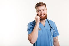 Artsenmens die het eenvormige spreken dragen Stock Foto's
