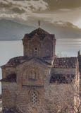 St. John the Theologian Canneo on the Rock - one of the most famous churches in Ohrid, against the backdrop of a dramatic sky. royalty free stock photo St. John the Theologian Canneo on the Rock - one of the most famous churches in Ohrid, against the backdrop of a dramatic sky. royalty free stock photo
