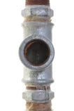 As instalações velhas, encaixes de tubulação do ferro fotografia de stock As instalações velhas, encaixes de tubulação do ferro fotografia de stock
