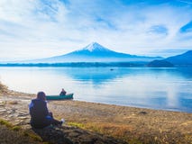 Asia girl traveler 30s to 40s sit and see her boyfriend sit on b royalty free stock photo Asia girl traveler 30s to 40s sit and see her boyfriend sit on b royalty free stock photo