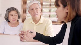 Asia smart female agent offers health insurance for elderly couples by document, tablet and laptop. Aged Asian couple consulting. stock video Asia smart female agent offers health insurance for elderly couples by document, tablet and laptop. Aged Asian couple consulting. stock video