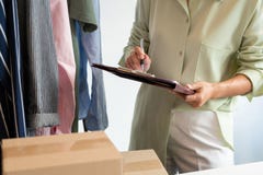 Asian Business Owner Working At Home With Packing Box Of Her Online Store Prepare To Deliver Products To Customers, Alpha Stock Photos