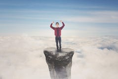 Asian businessman celebrating his success on mountain stock image Asian businessman celebrating his success on mountain stock image