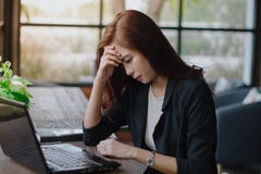 Asian businesswoman serious about the work done until the headache royalty free stock images Asian businesswoman serious about the work done until the headache royalty free stock images