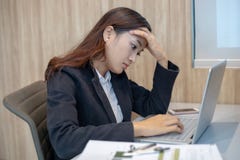 Asian businesswoman serious about the work hard done until the stock photos Asian businesswoman serious about the work hard done until the stock photos